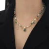 Elegant Beaded Necklace With Green And Pearl Accents